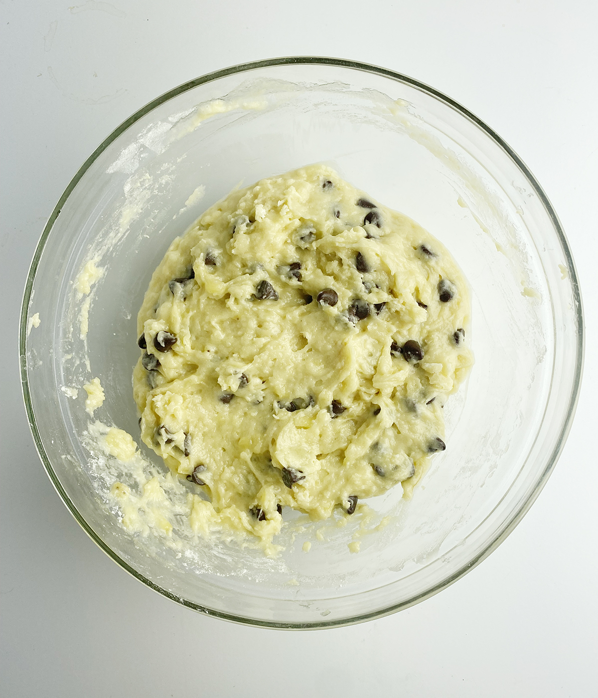 Banana chocolate chip batter in a mixing bowl.