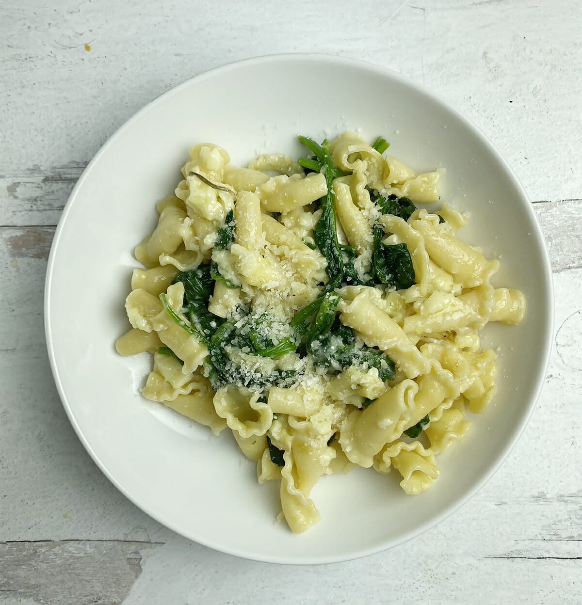 Plate of pasta with baked camembert.