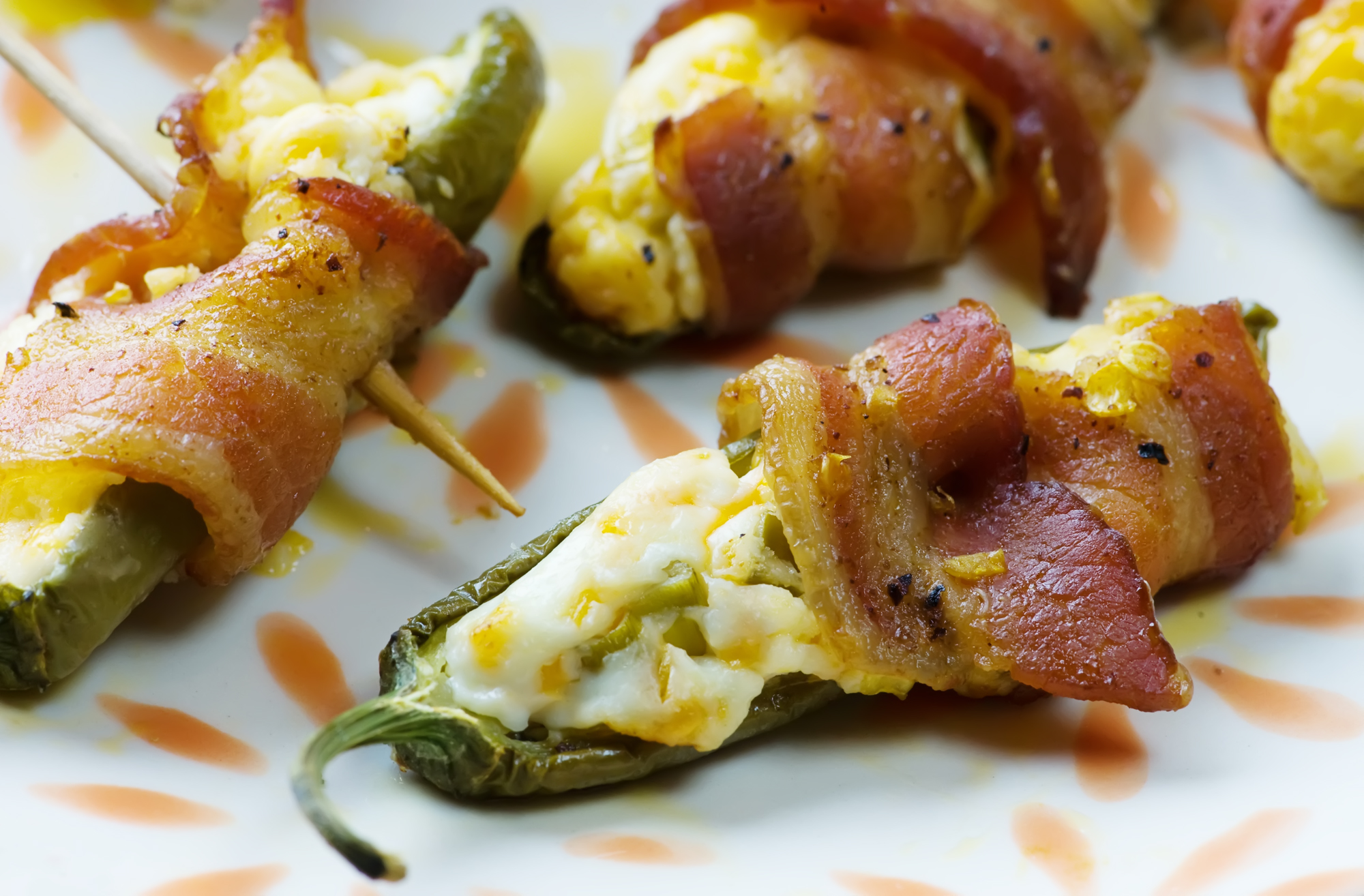 Jalapeno poppers on a plate.