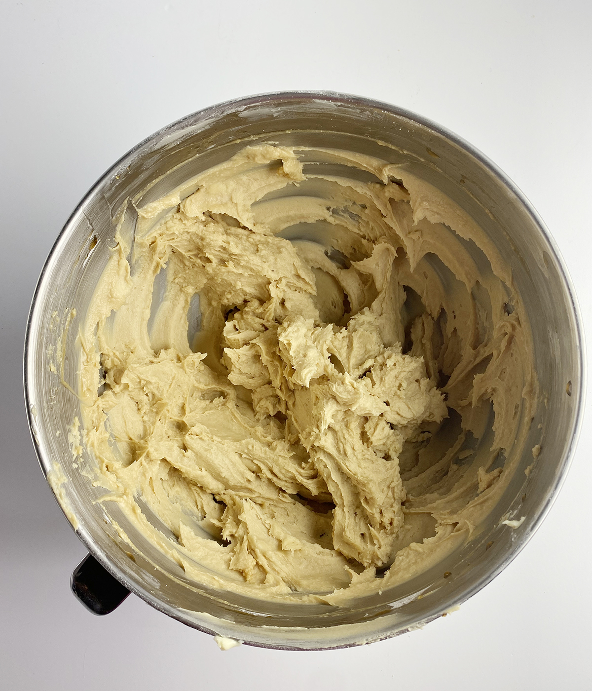 Creamed butter and flour in a mixing bowl.