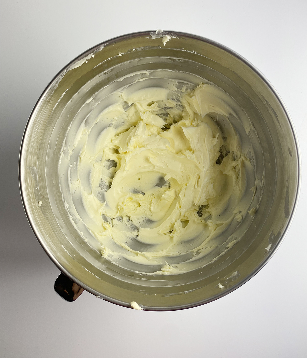 Creamed butter in a mixing bowl.