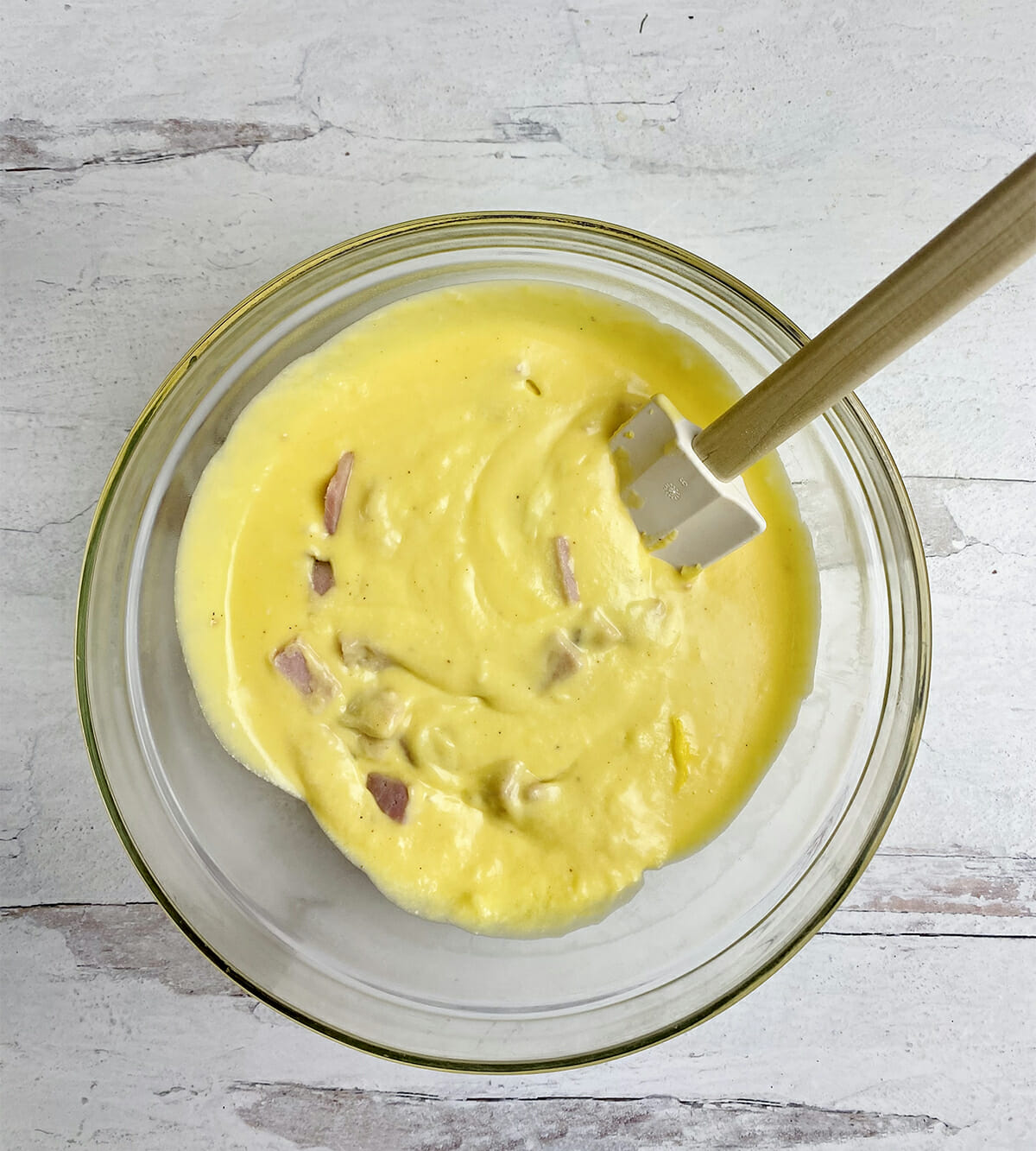 Ham and egg mixture in a mixing bowl.