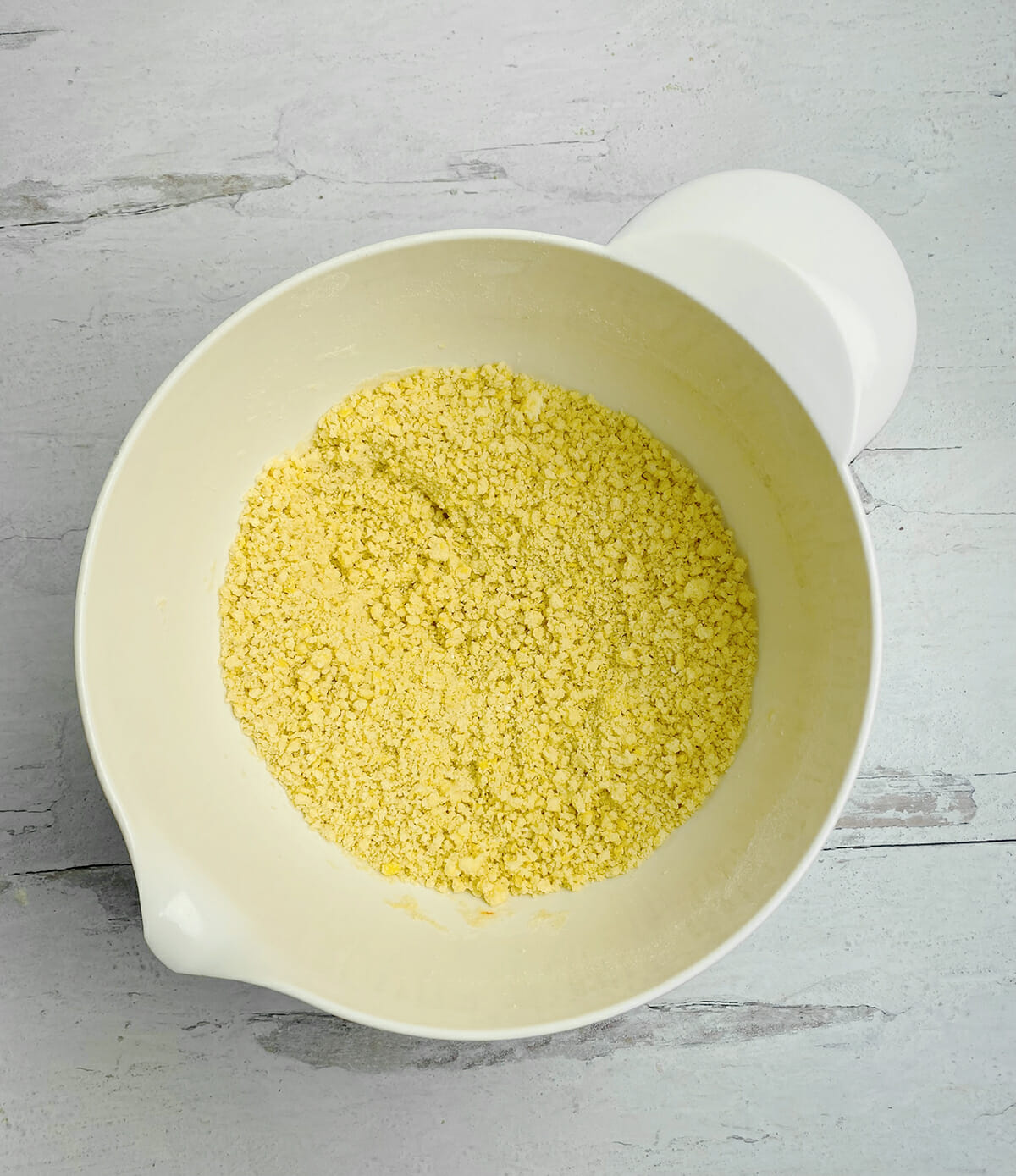 Payday bars cake mixture in a mixing bowl.