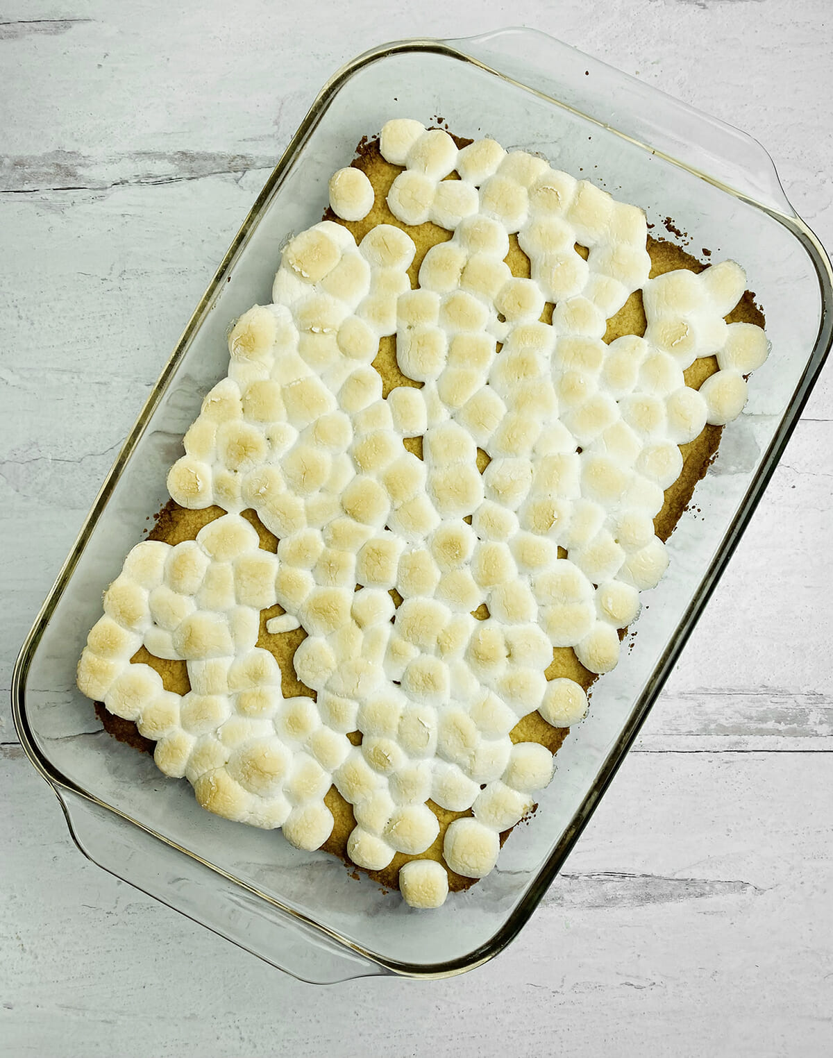 Payday bars marshmallow layer in a casserole.