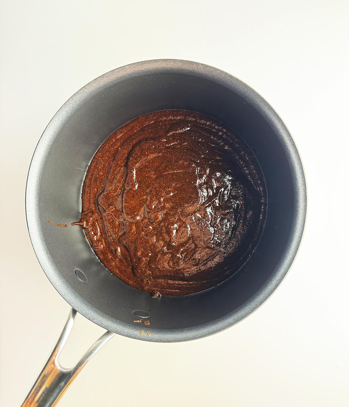 Pot of barbecue sauce.