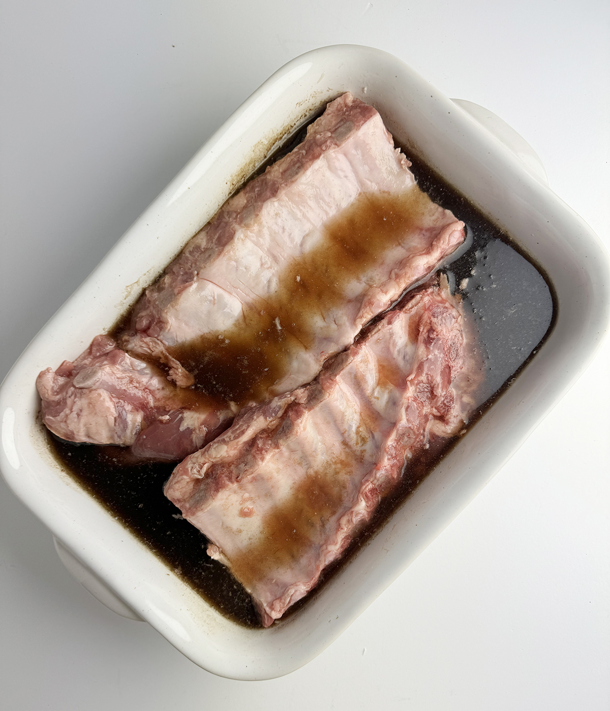 Ribs marinating in Cola soda.