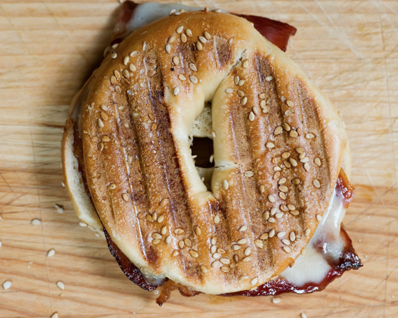 Brown sugar bacon and cheddar cheese pressed between bagel halves is a panini like no other!