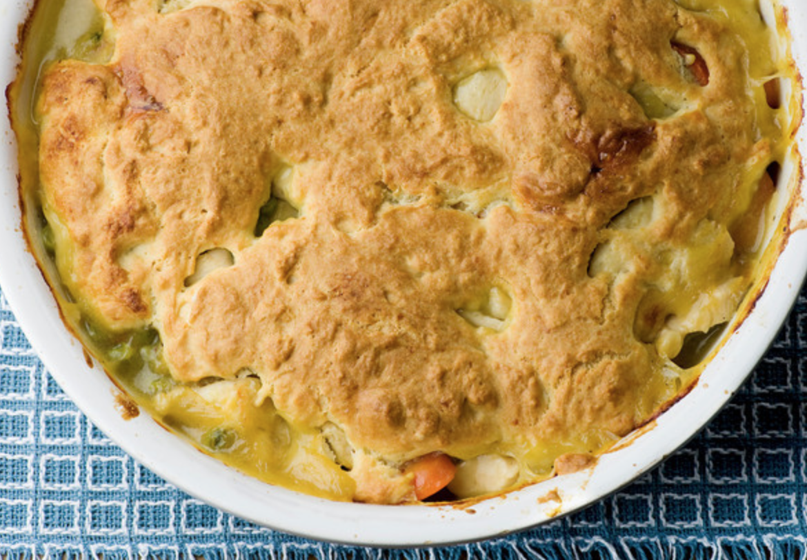 Chicken vegetable cobbler in a round baking dish.