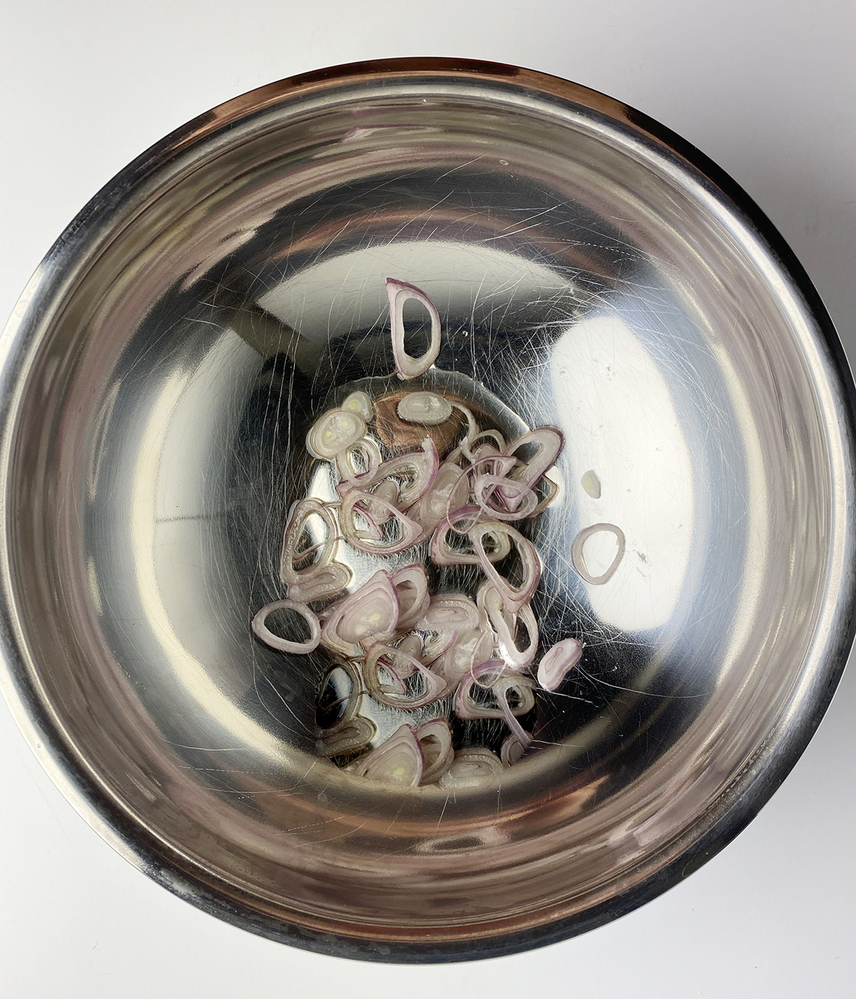 Shallot and vinegar mixture in a bowl.