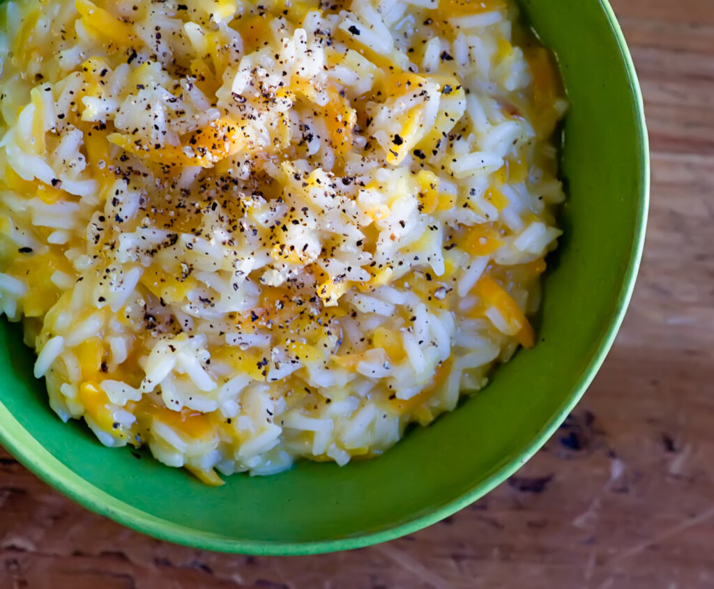 carrot parmesan risotto Bowl of carrot risotto.