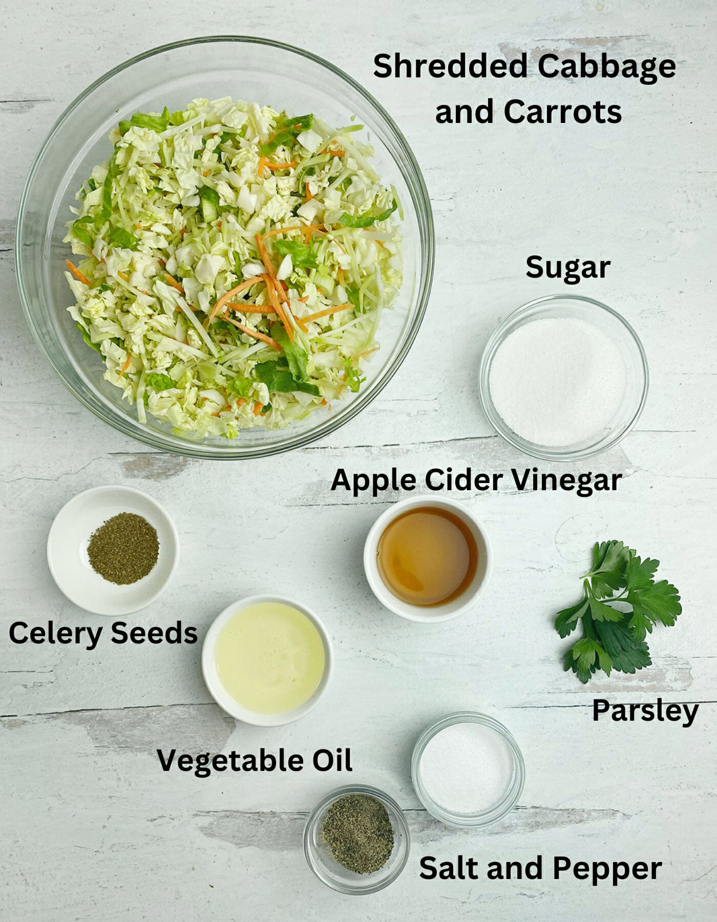 Vinegar coleslaw ingredients on a counter.