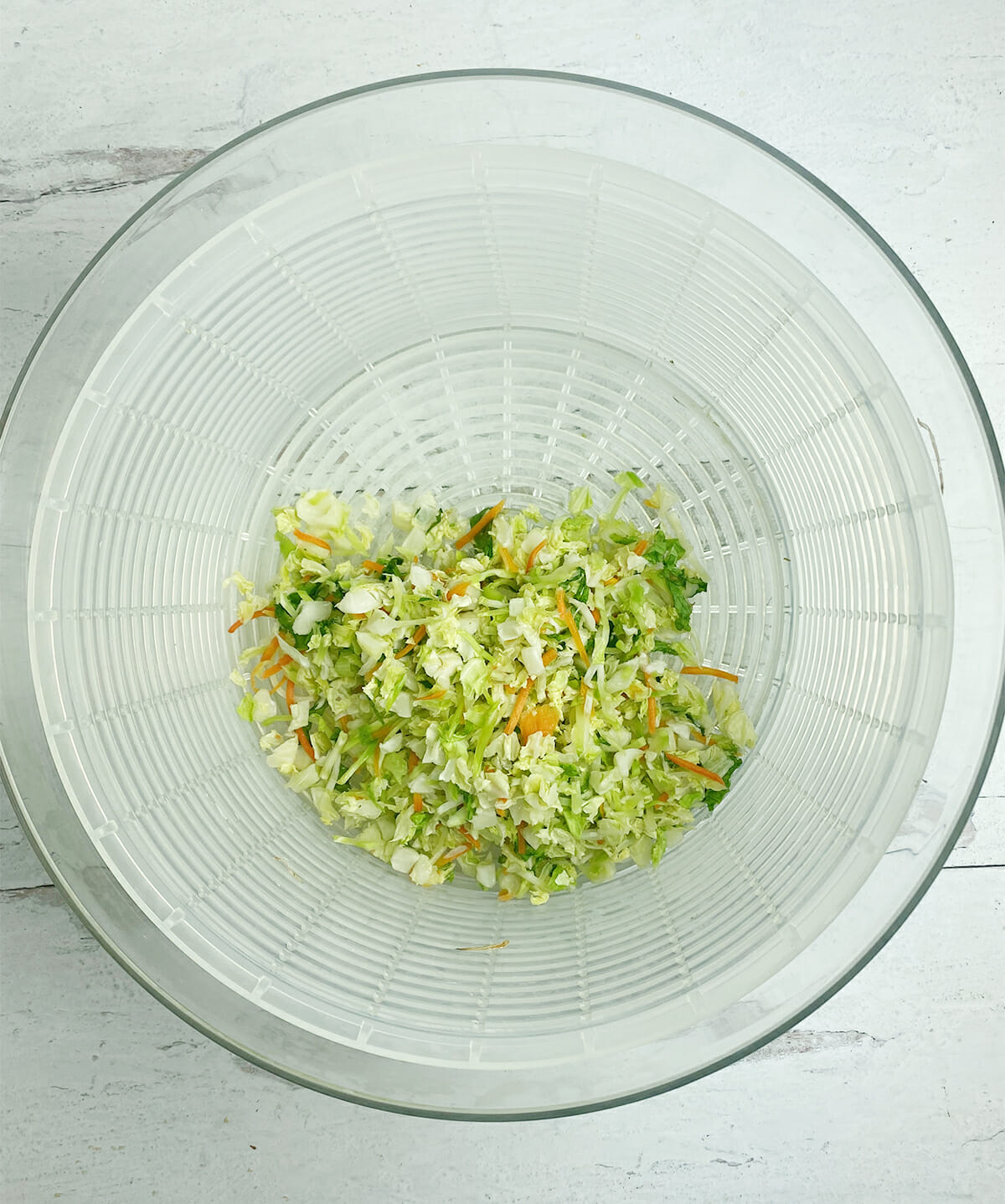 Coleslaw in a salad spinner.