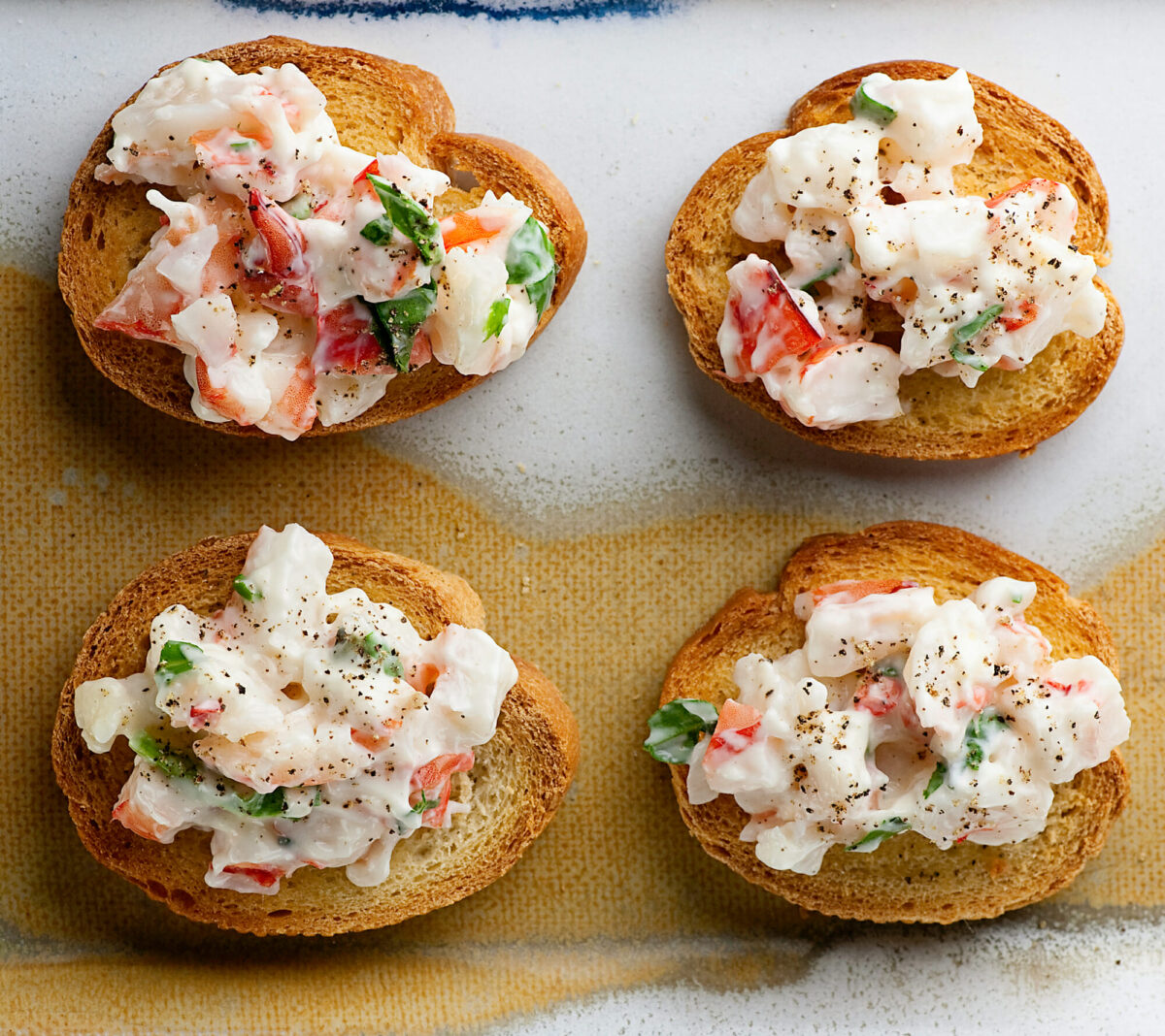 Shrimp crostini on a platter.