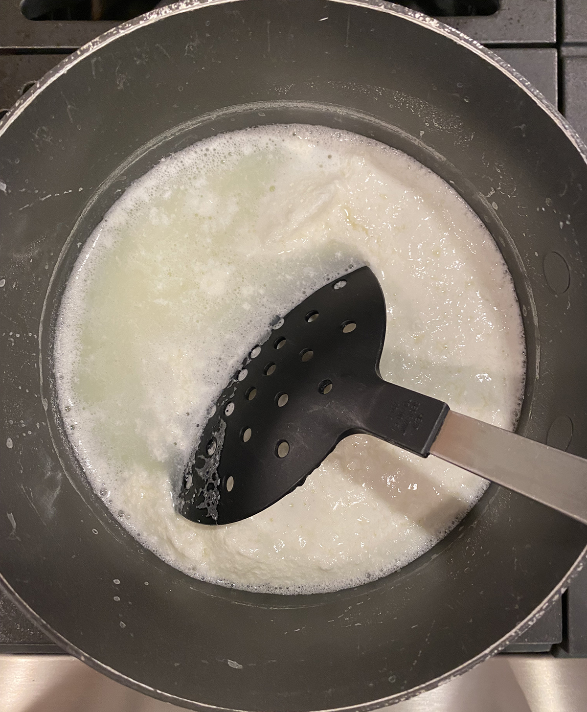 fresh ricotta separating in pot