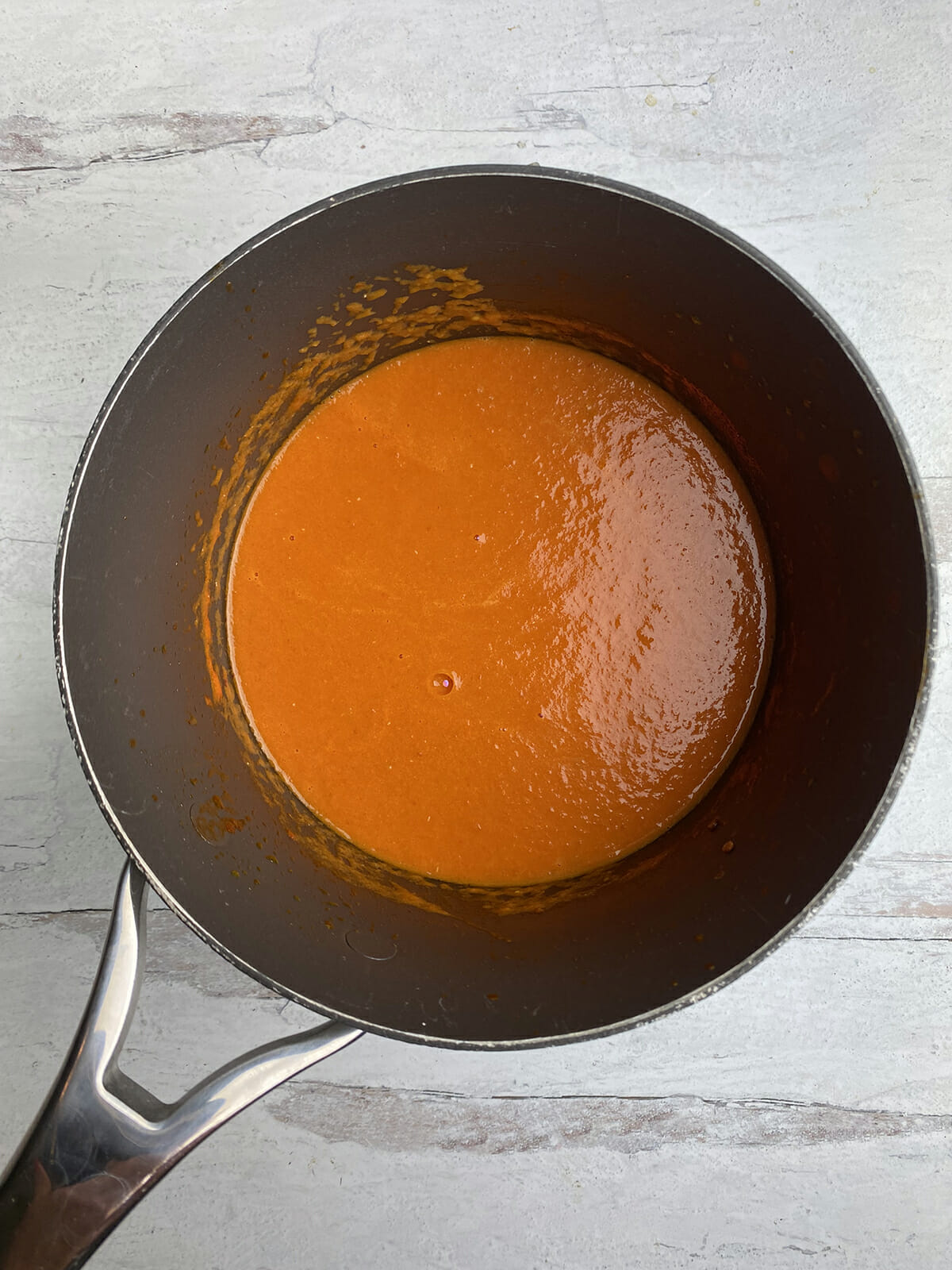 Tomato sauce pureed in a pot.