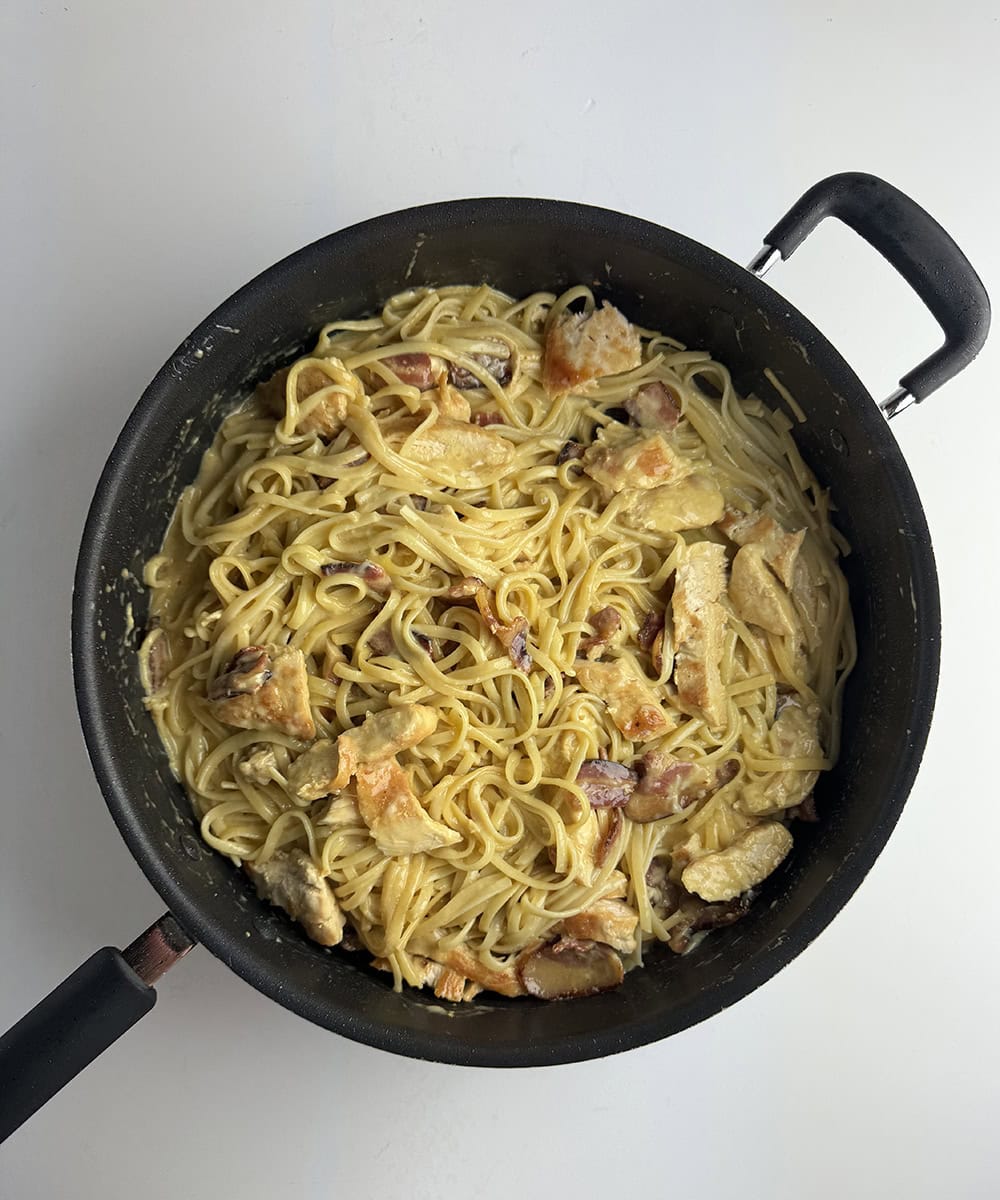 Chicken carbonara in a skillet.