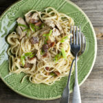 Loaded chicken carbonara on a plate.