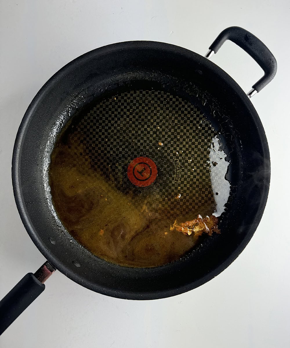 Reduced wine in a skillet.