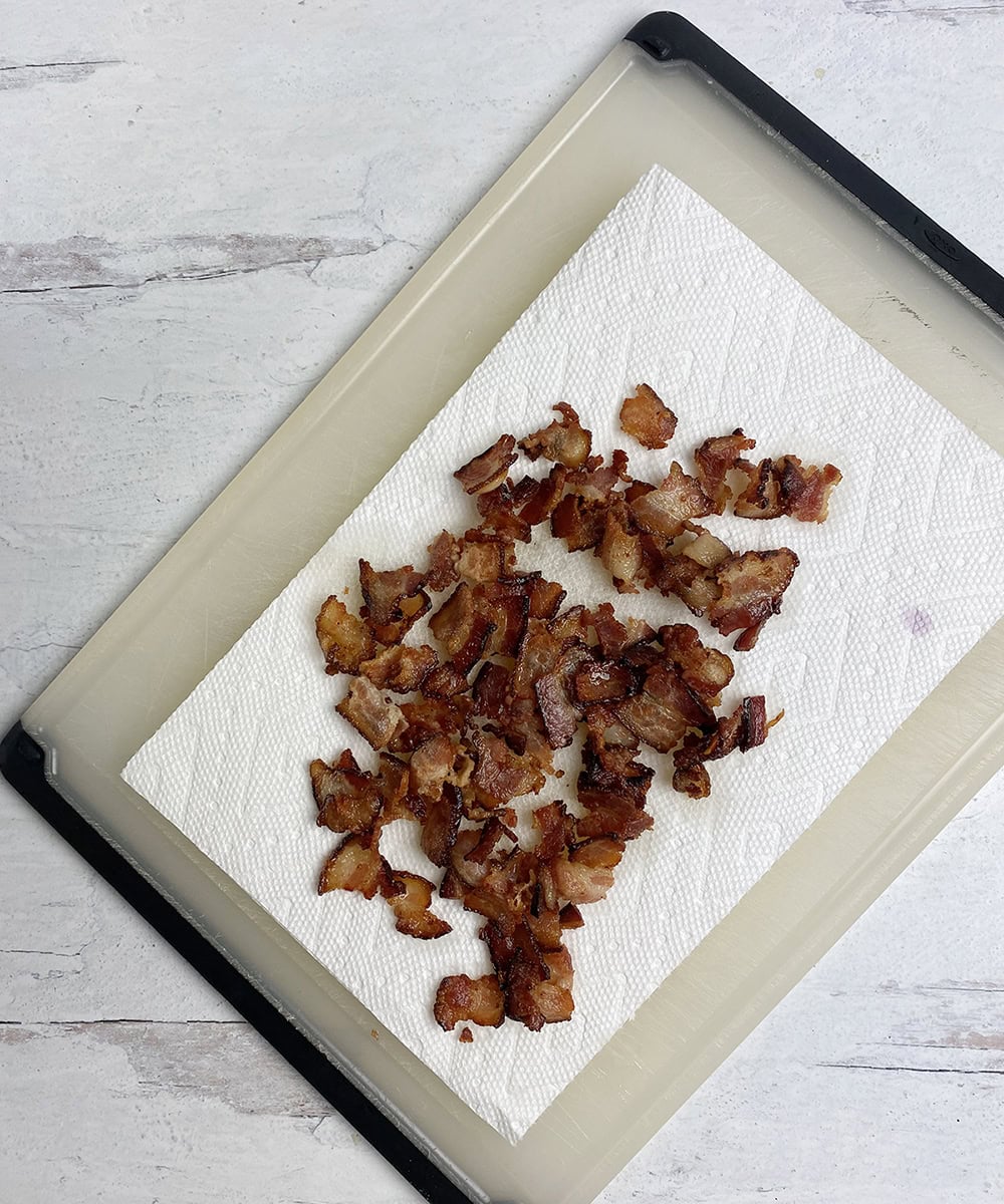 Chopped bacon draining on paper towels.