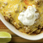 Beef Enchilada Casserole on a placemat.