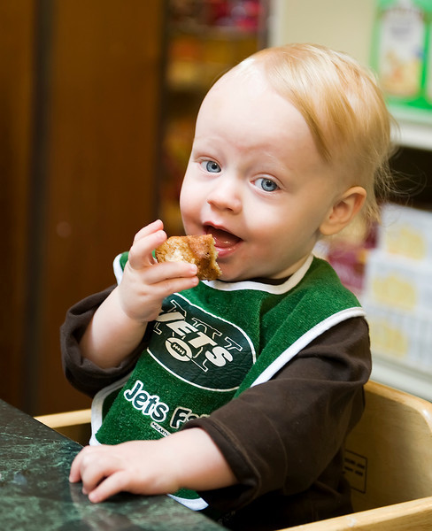 baby eating donut