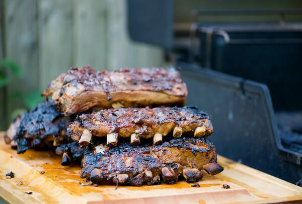 Grandpa's Coca-Cola Ribs on a board next to the grill.