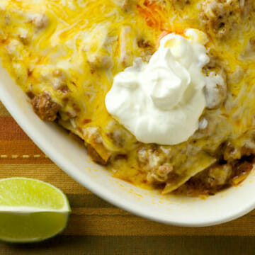 Beef Enchilada Casserole with a dollop of sour cream on top.