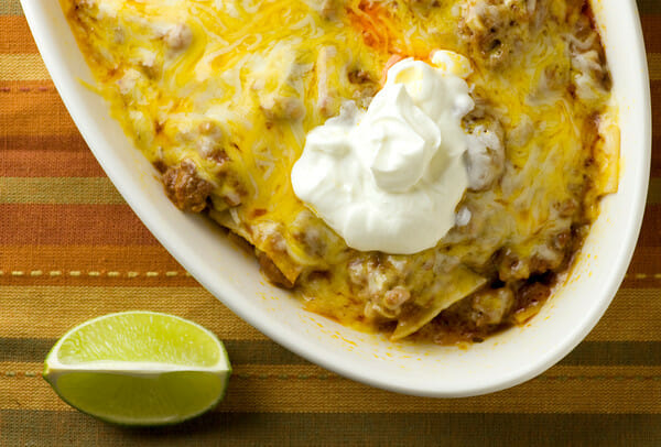 Beef Enchilada Casserole with a dollop of sour cream on top.