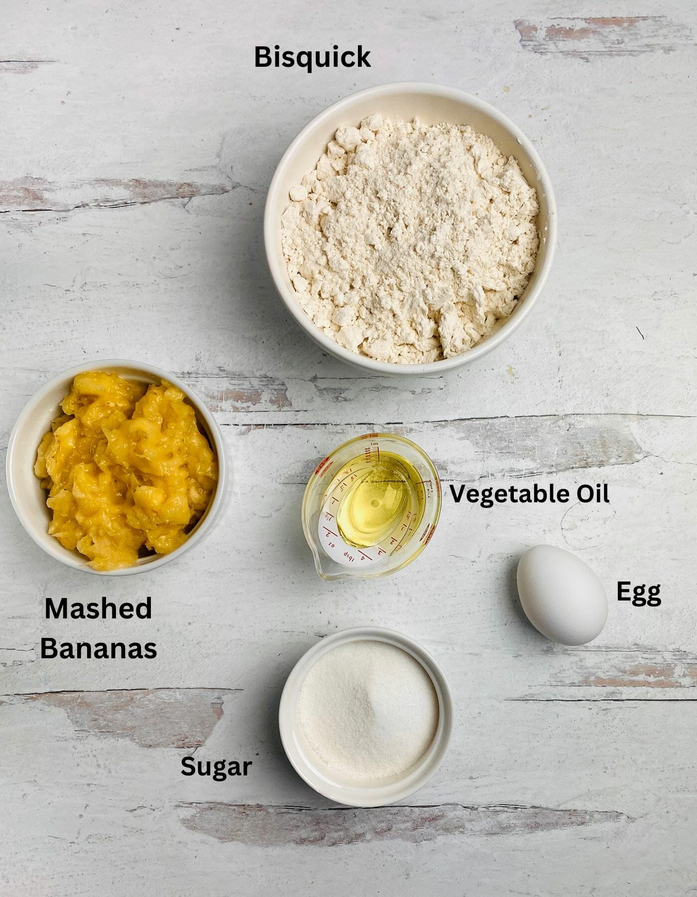 Banana Muffin Ingredients on a wooden board.