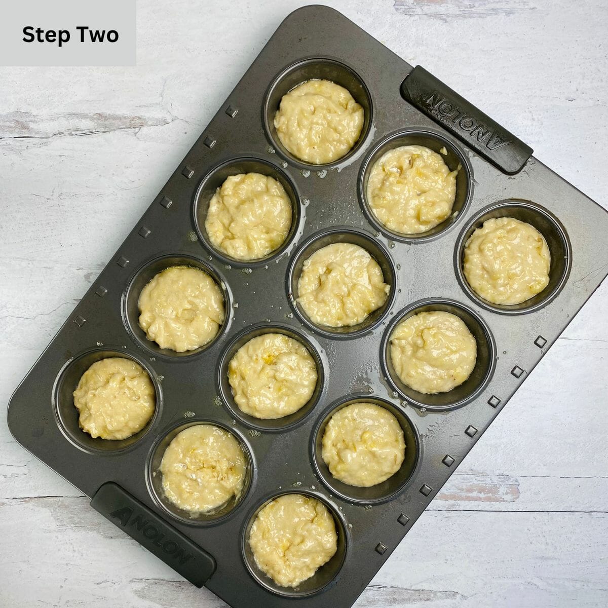 Banana Muffins batter in a muffin tin.