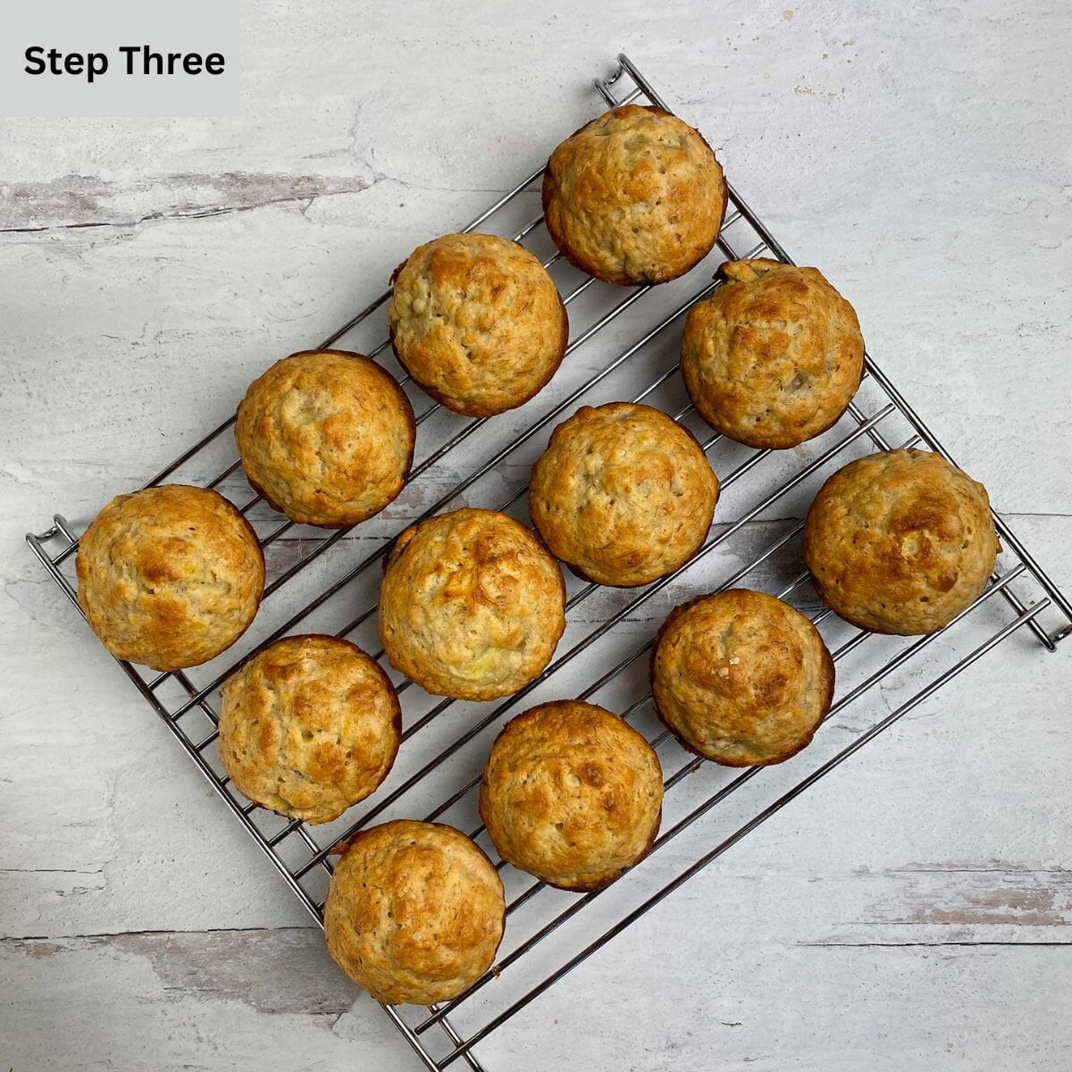 Banana muffins cooling on a rack.