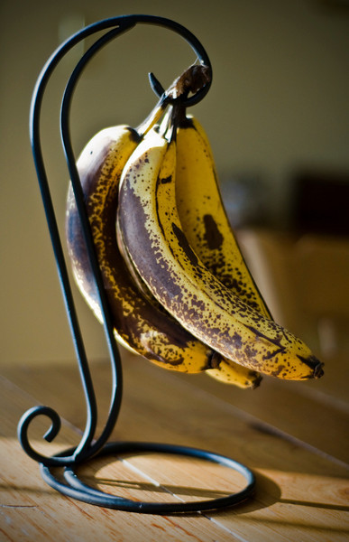 Ripe bananas on a banana stand.