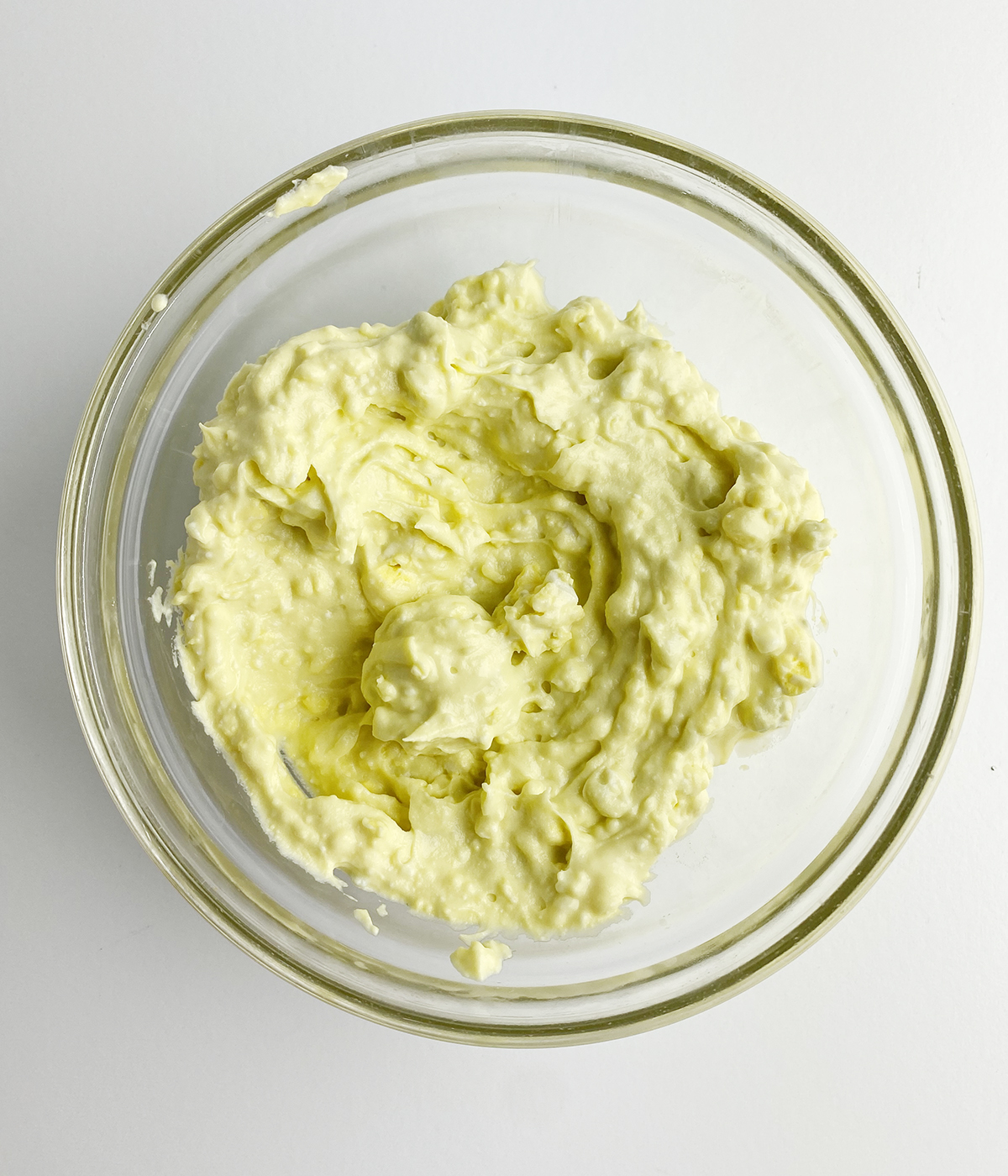 Deviled egg yolk mixture in a mixing bowl.