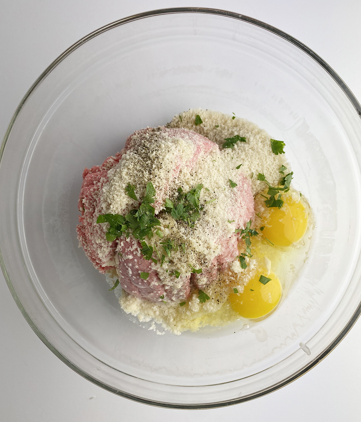 Meatball ingredients in a mixing bowl.