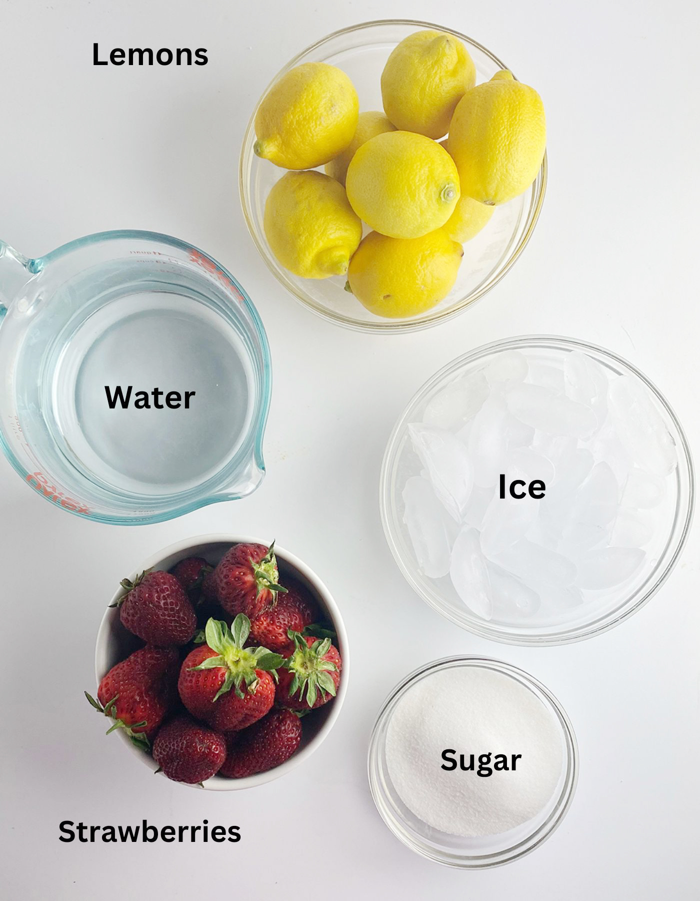 Ingredients needed for homemade strawberry lemonade.