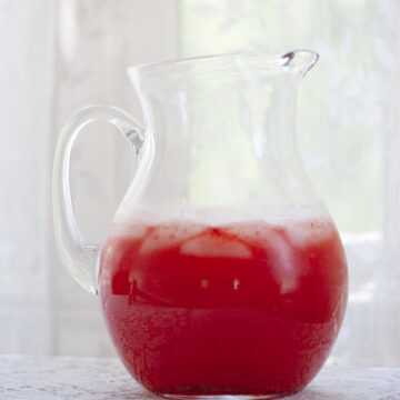 Pitcher of strawberry lemonade.
