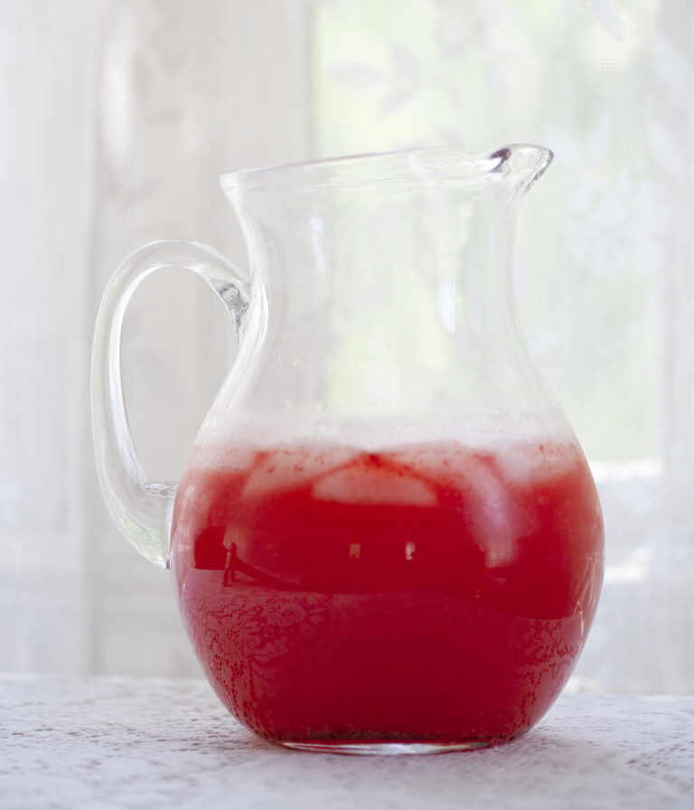Pitcher of strawberry lemonade.