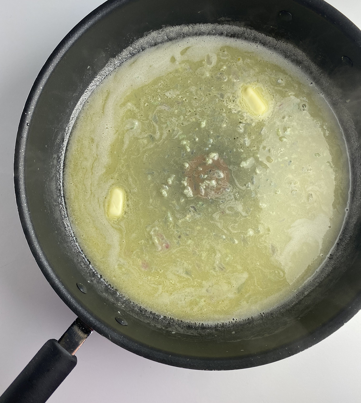 melted butter in skillet