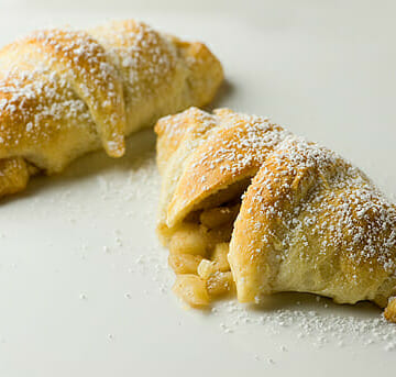 Easy Mini Apple Pies resting on the counter.