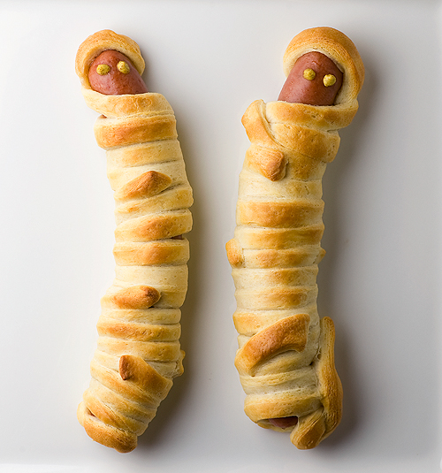 Hot Dog Mummies Hot dog mummies on a white plate.