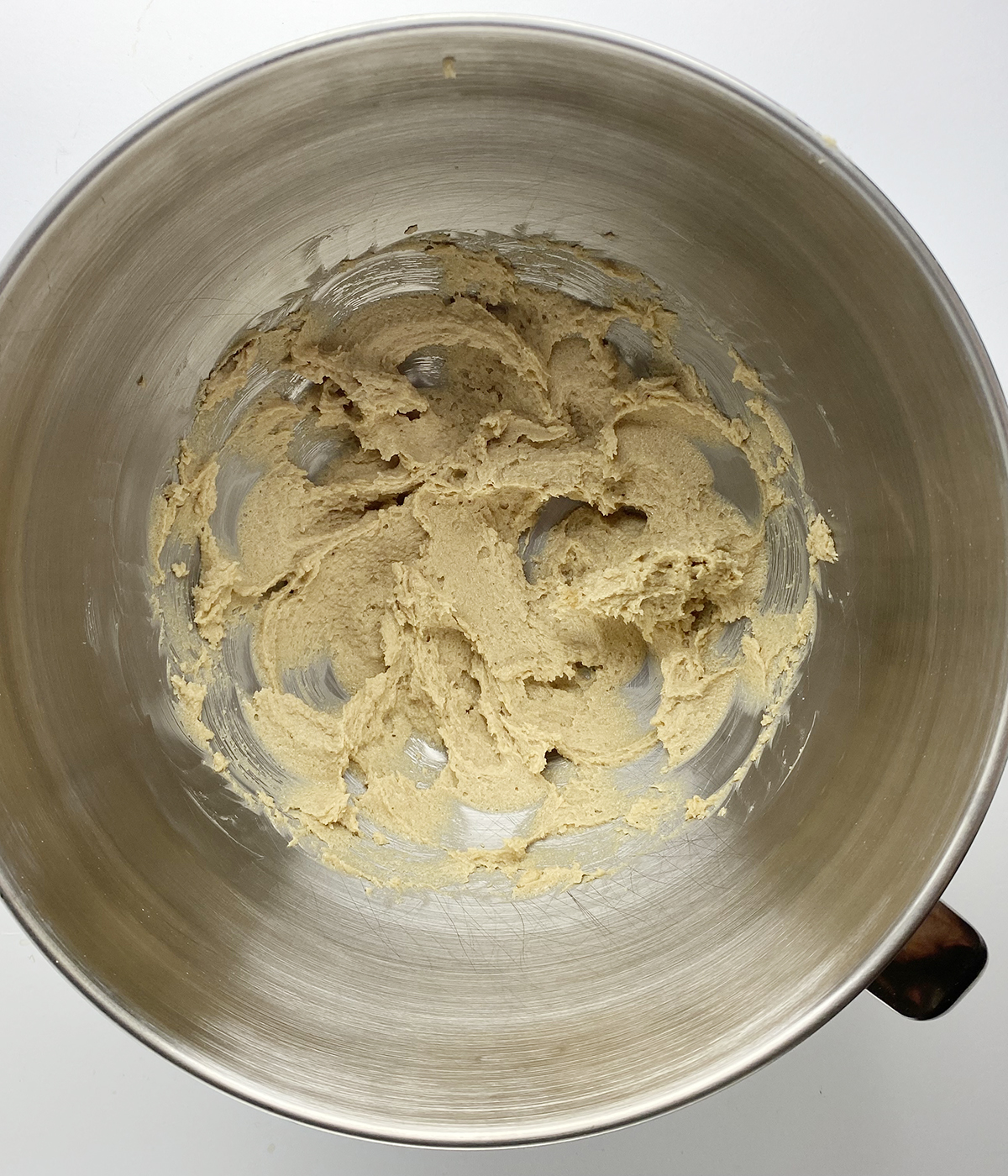 Creamed butter and brown sugar in mixing bowl.