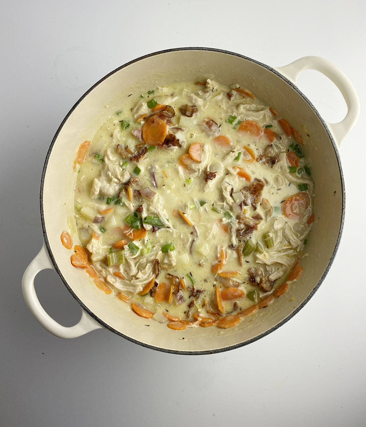 Finished creamy chicken stew in Dutch oven.