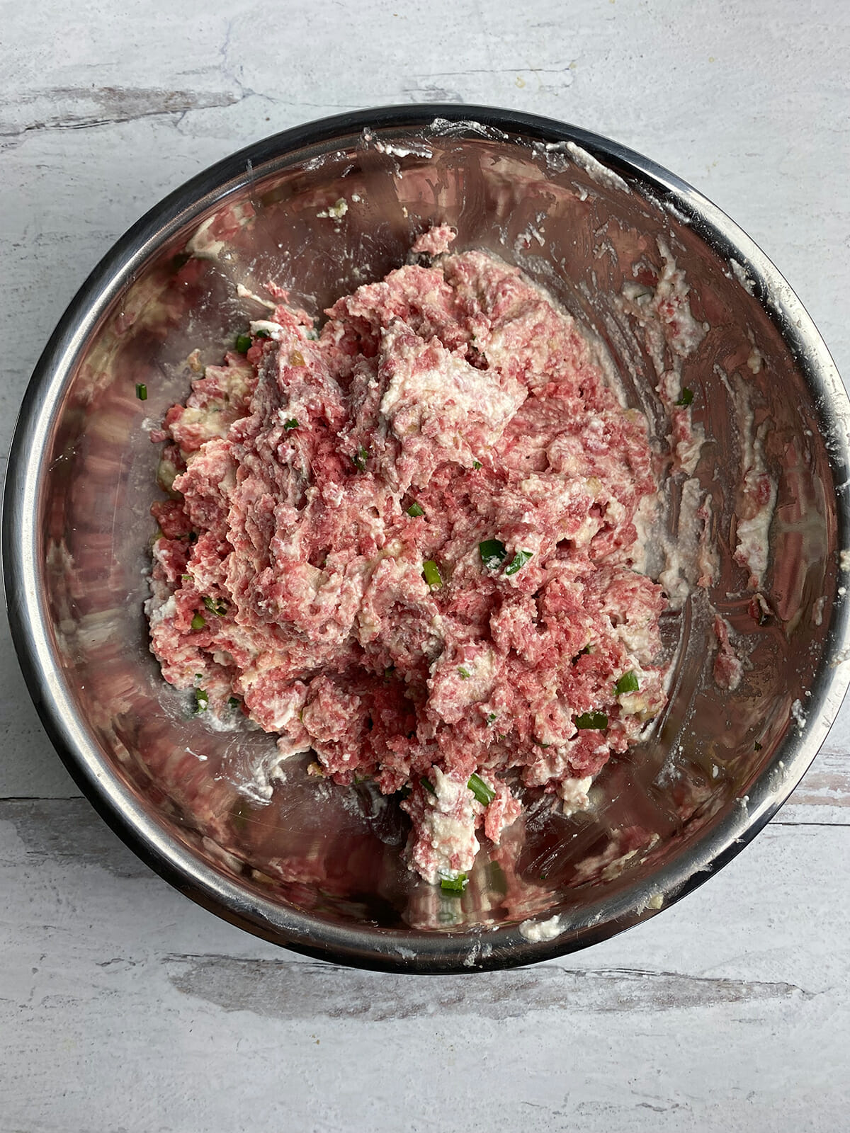 Fully mixed ricotta meatloaf mixture in a bowl.