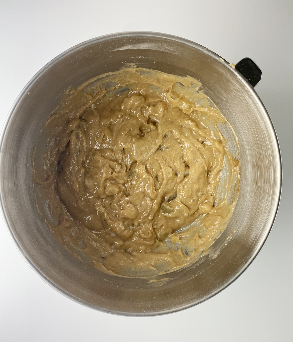 Apple cake batter in a mixing bowl.