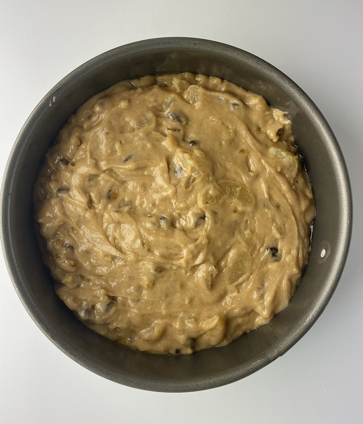 Apple cake batter in mixing bowl.