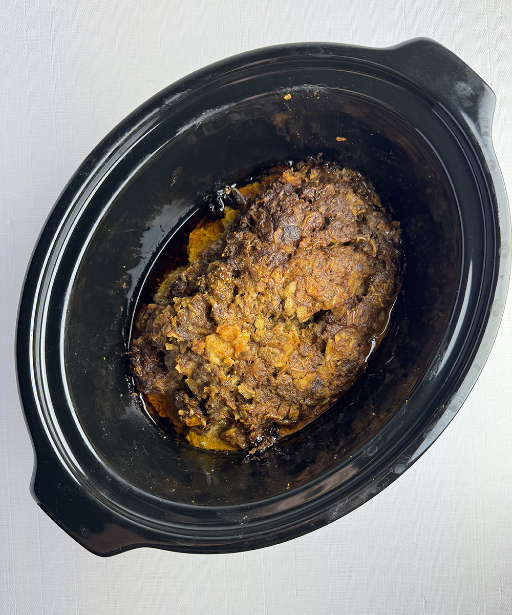 Cooked Taco Meatloaf in a slow cooker.