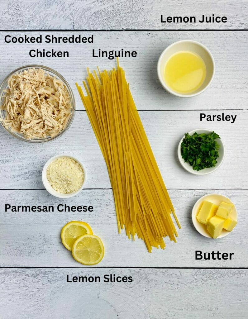 Ingredients for Lemon Chicken Pasta on a wooden counter.