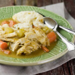Slow cooker chicken and dumplings on a plate.