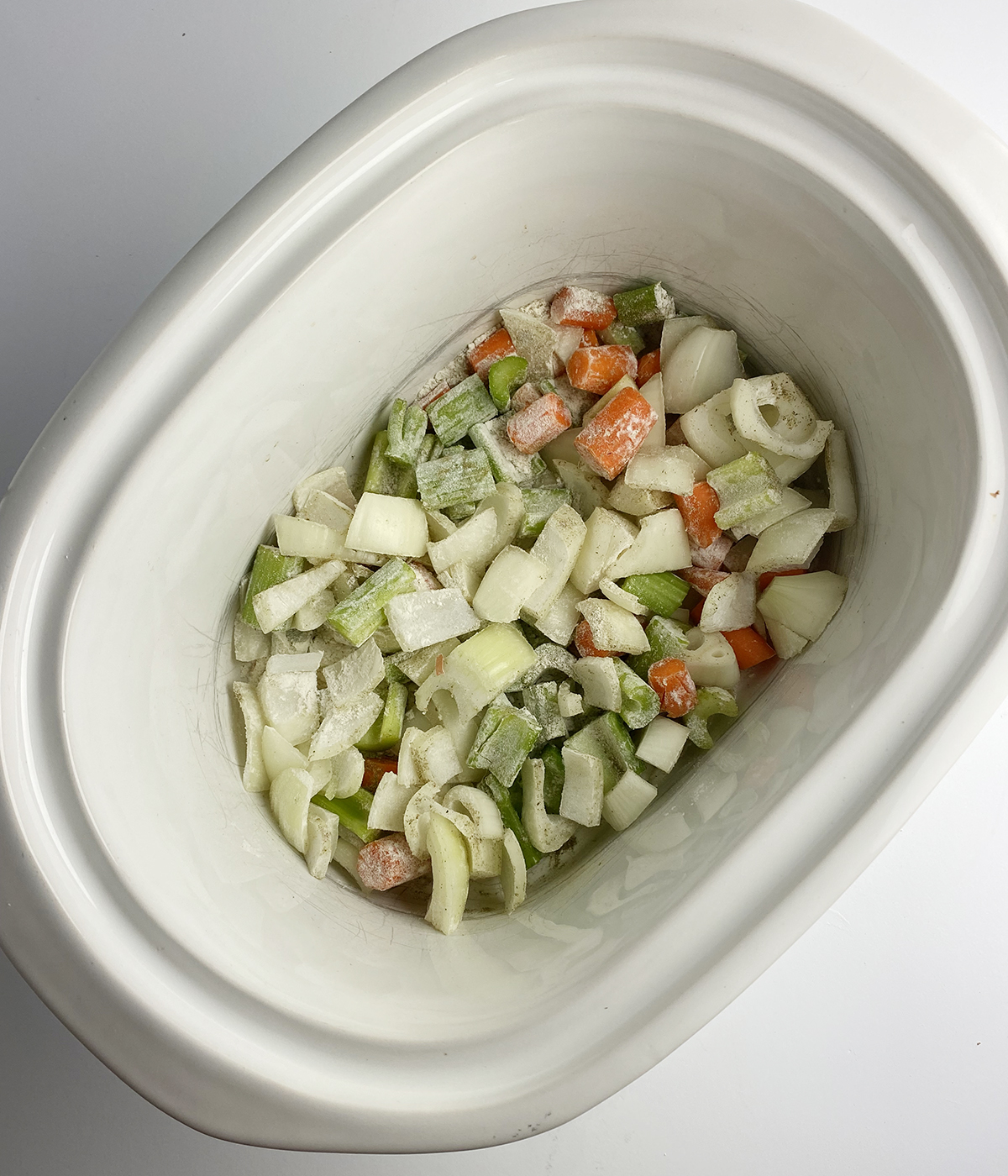 Vegetables with flour in a slow cooker.