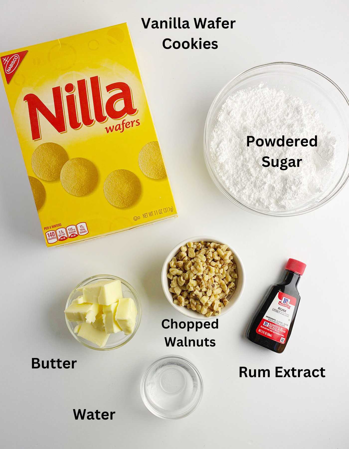 Rum ball ingredients on a white counter.